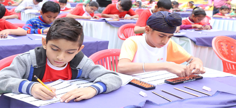 Kids taking exam after Abacus Training